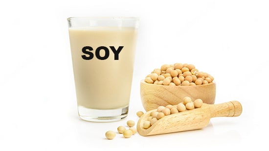 a_cup_of_soybeans_and_a_measuring_spoon_next_to_a_glass_of_soy_protein