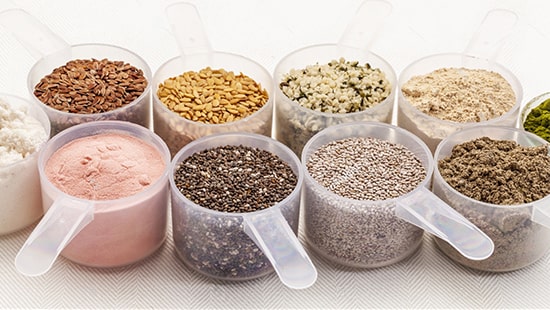 ten_scoops_filled_with_different_types_of_protein_powders_and_cereals